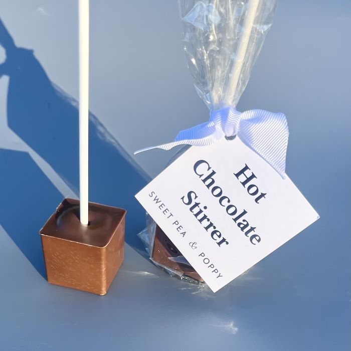 Two milk hot chocolate stirrers